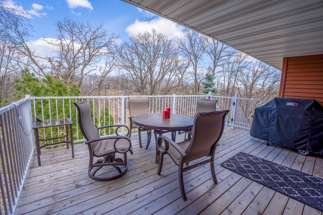 122 Ridge Rd, New London, MN 56273 - deck featuring outdoor dining space and grilling area
