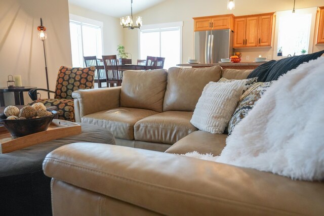 122 Ridge Rd, New London, MN 56273 - living area featuring a chandelier and lofted ceiling