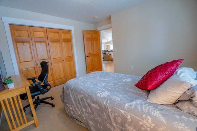 122 Ridge Rd, New London, MN 56273 - carpeted bedroom featuring a closet and an office area
