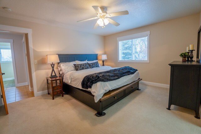 122 Ridge Rd, New London, MN 56273 - bedroom with carpet floors, baseboards, and a ceiling fan