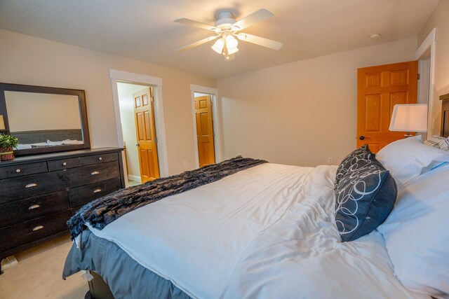 122 Ridge Rd, New London, MN 56273 - bedroom featuring light colored carpet and ceiling fan