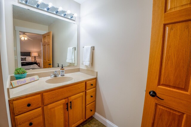 122 Ridge Rd, New London, MN 56273 - bathroom with vanity, ensuite bath, and ceiling fan