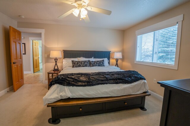 122 Ridge Rd, New London, MN 56273 - bedroom with light colored carpet, baseboards, and ceiling fan