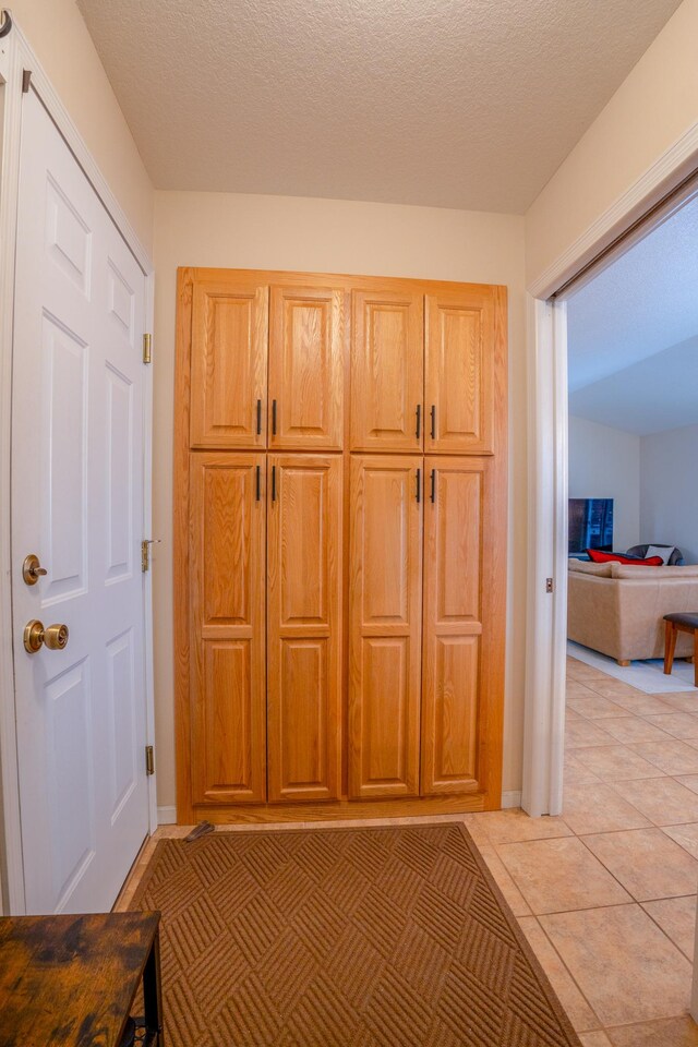 122 Ridge Rd, New London, MN 56273 - detailed view of baseboards and a textured ceiling