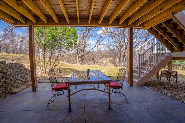 122 Ridge Rd, New London, MN 56273 - view of patio / terrace with stairway and outdoor dining area
