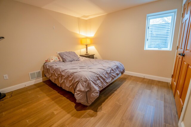 122 Ridge Rd, New London, MN 56273 - bedroom featuring baseboards and light wood finished floors