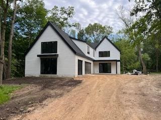 25955 Wild Rose Ln, Shorewood, MN 55331 - view of front of home with dirt driveway