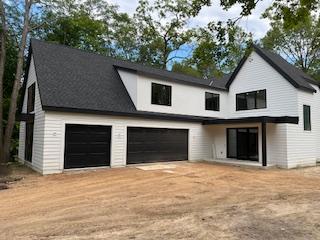 25955 Wild Rose Ln, Shorewood, MN 55331 - view of front of house featuring an attached garage