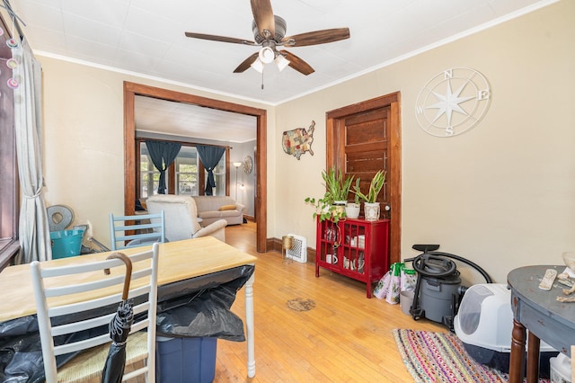 560 Stryker Ave, Saint Paul, MN 55107 - home office featuring ornamental molding, light wood-style flooring, and ceiling fan