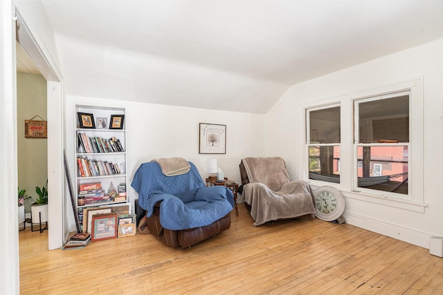 560 Stryker Ave, Saint Paul, MN 55107 - sitting room with light wood finished floors, lofted ceiling, and baseboards
