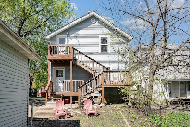 560 Stryker Ave, Saint Paul, MN 55107 - rear view of house with a deck and stairway