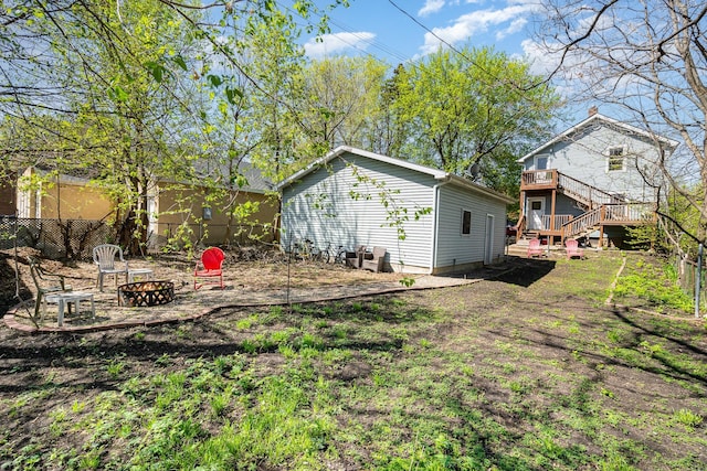 560 Stryker Ave, Saint Paul, MN 55107 - view of yard featuring a fire pit, stairway, fence, and a wooden deck