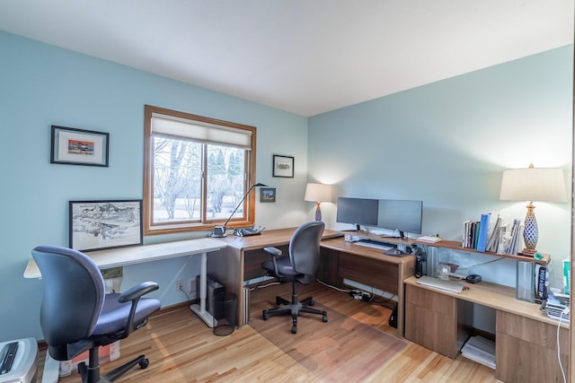 office area with light wood-style floors