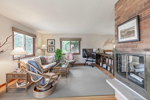 30 Interlachen Ln, Tonka Bay, MN 55331 - living room featuring a fireplace, healthy amount of natural light, and a textured ceiling