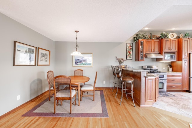 30 Interlachen Ln, Tonka Bay, MN 55331 - dining space featuring light wood-style flooring and recessed lighting
