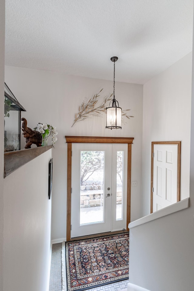 30 Interlachen Ln, Tonka Bay, MN 55331 - foyer entrance featuring a chandelier and a textured ceiling