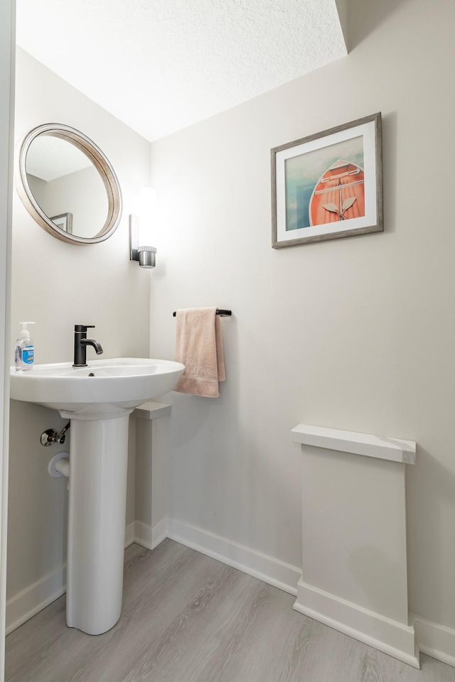 30 Interlachen Ln, Tonka Bay, MN 55331 - bathroom featuring wood finished floors and baseboards