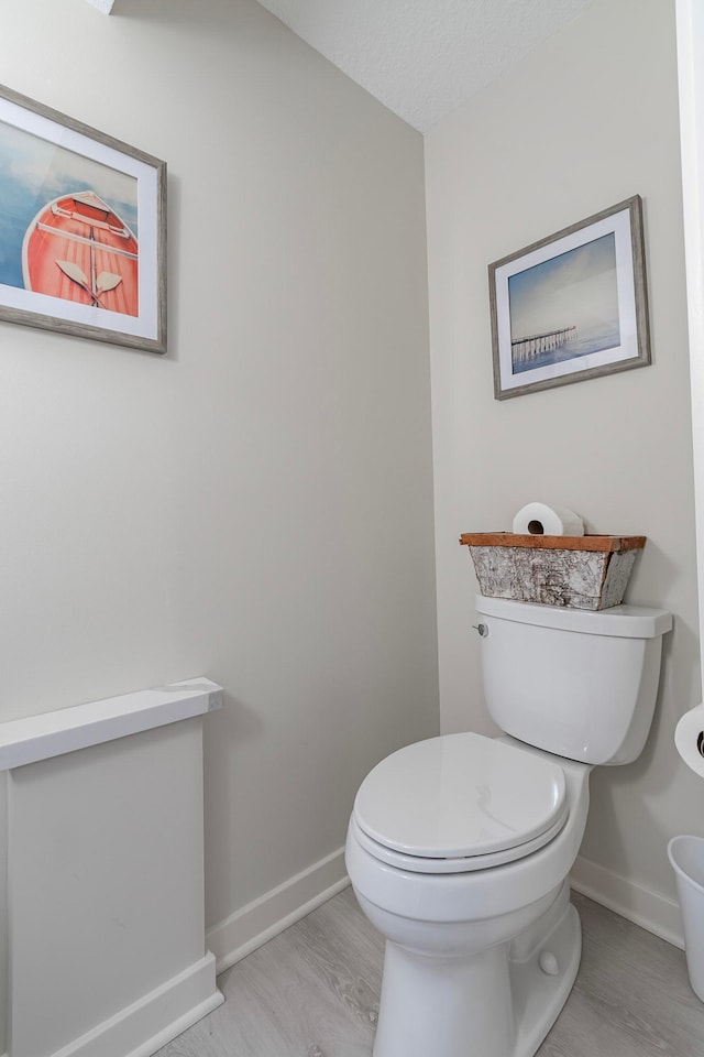 30 Interlachen Ln, Tonka Bay, MN 55331 - bathroom featuring baseboards and wood finished floors