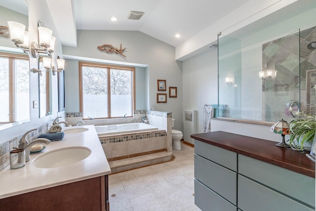 30 Interlachen Ln, Tonka Bay, MN 55331 - bathroom featuring a chandelier, double vanity, a garden tub, a stall shower, and tile patterned floors