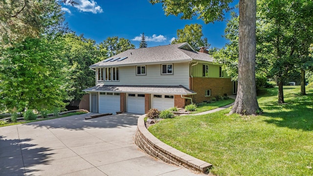 30 Interlachen Ln, Tonka Bay, MN 55331 - view of front of property with a garage, a chimney, brick siding, driveway, and a front lawn