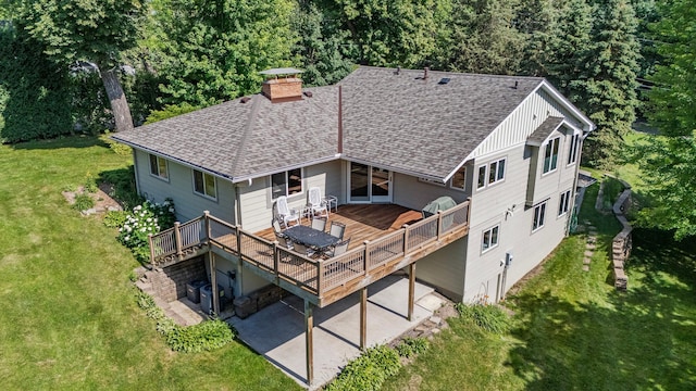 30 Interlachen Ln, Tonka Bay, MN 55331 - back of house with a patio area, a wooden deck, a shingled roof, a lawn, and a chimney
