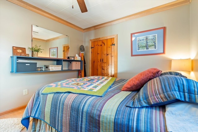 bedroom with crown molding and wood finished floors