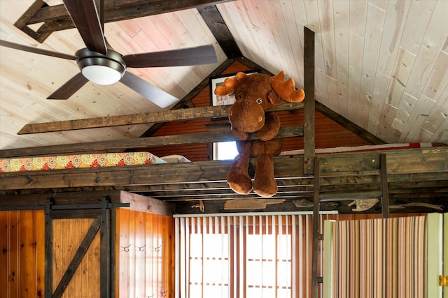 detailed view of wood ceiling, beam ceiling, and a ceiling fan
