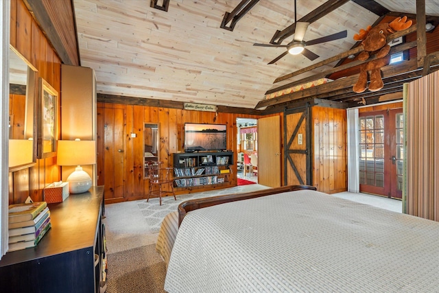 carpeted bedroom with vaulted ceiling, wooden walls, french doors, wood ceiling, and access to outside