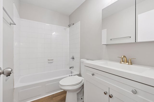 full bathroom with vanity, toilet, bathing tub / shower combination, and wood finished floors
