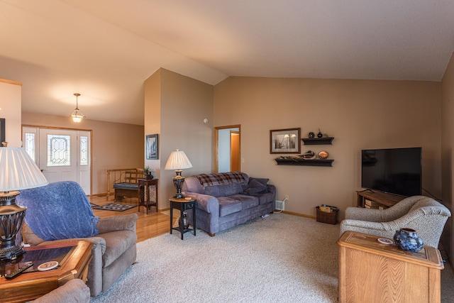 48987 Tamarac Dr, Scambler Twp, MN 56572 - carpeted living room featuring lofted ceiling and baseboards