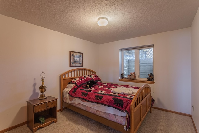 48987 Tamarac Dr, Scambler Twp, MN 56572 - bedroom with a textured ceiling, carpet flooring, and baseboards