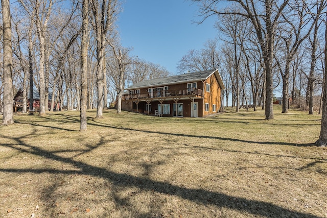 48987 Tamarac Dr, Scambler Twp, MN 56572 - back of house with a wooden deck and a yard