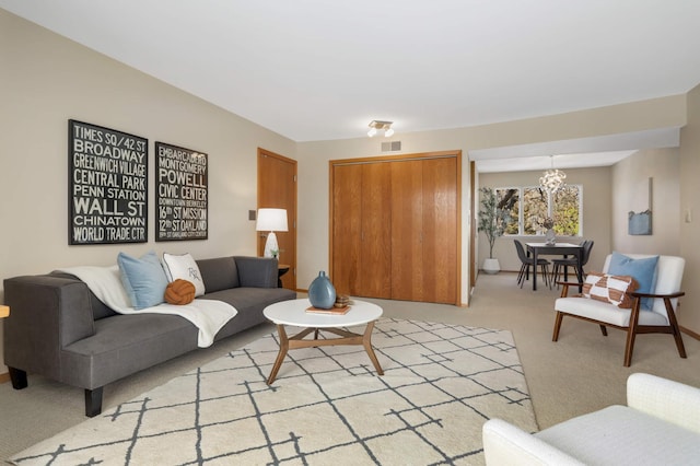 1261 Cleveland Ave N Unit 8A, Saint Paul, MN 55108 - living room with an inviting chandelier, light carpet, and visible vents