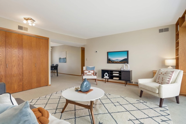 1261 Cleveland Ave N Unit 8A, Saint Paul, MN 55108 - living area featuring visible vents, baseboards, and light colored carpet