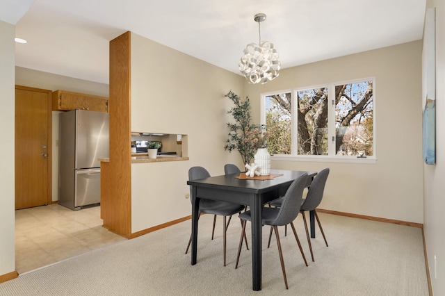 1261 Cleveland Ave N Unit 8A, Saint Paul, MN 55108 - dining area featuring baseboards, a chandelier, and light carpet