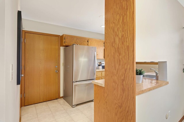 1261 Cleveland Ave N Unit 8A, Saint Paul, MN 55108 - kitchen featuring freestanding refrigerator and a sink