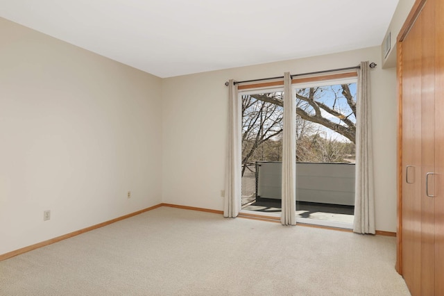 1261 Cleveland Ave N Unit 8A, Saint Paul, MN 55108 - spare room featuring baseboards and light carpet