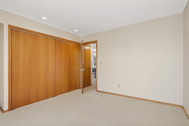 1261 Cleveland Ave N Unit 8A, Saint Paul, MN 55108 - unfurnished bedroom with recessed lighting, baseboards, light colored carpet, and a closet