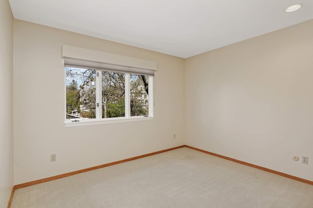 1261 Cleveland Ave N Unit 8A, Saint Paul, MN 55108 - spare room featuring baseboards, light carpet, and recessed lighting