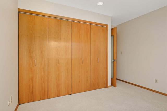 1261 Cleveland Ave N Unit 8A, Saint Paul, MN 55108 - unfurnished bedroom with recessed lighting, baseboards, light colored carpet, and a closet