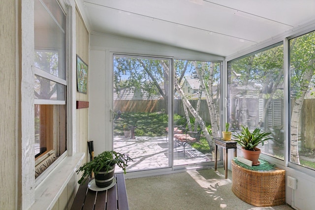 sunroom featuring vaulted ceiling
