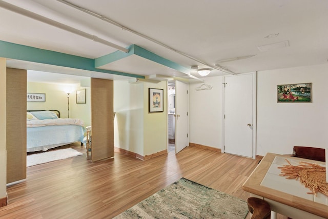 bedroom featuring light wood-type flooring and baseboards