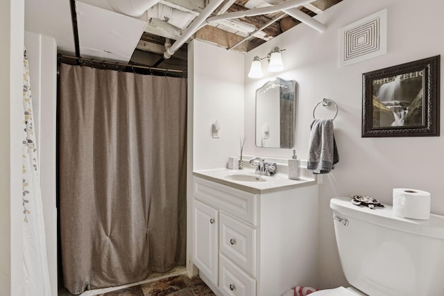 bathroom with vanity and toilet