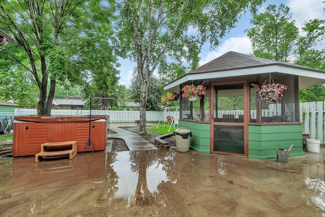 257 Elm Dr, Foley, MN 56329 - surrounding community with a jacuzzi, a patio area, and a fenced backyard