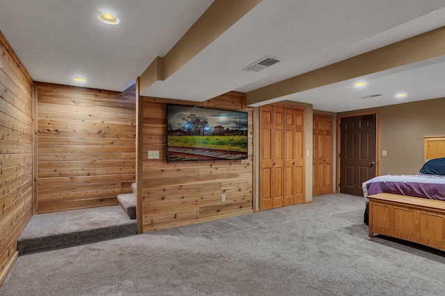 257 Elm Dr, Foley, MN 56329 - carpeted bedroom featuring wooden walls and recessed lighting