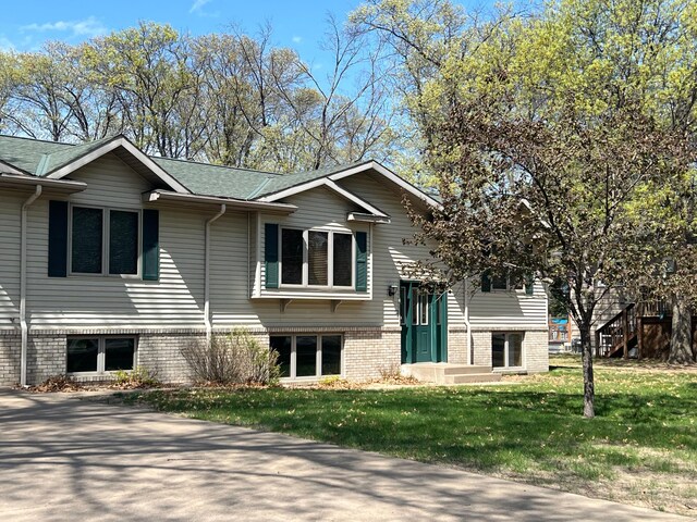 14289 Memorywood Dr, Baxter, MN 56425 - view of front of property with a front lawn and a shingled roof