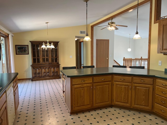 14289 Memorywood Dr, Baxter, MN 56425 - kitchen with vaulted ceiling, dark countertops, light floors, a peninsula, and a ceiling fan