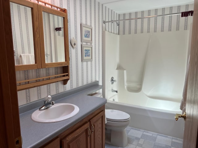 14289 Memorywood Dr, Baxter, MN 56425 - full bathroom with wallpapered walls, tub / shower combination, toilet, vanity, and tile patterned floors
