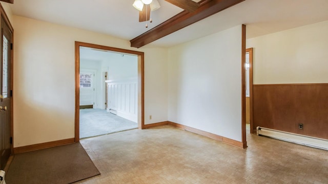 empty room featuring beamed ceiling, baseboard heating, and a ceiling fan