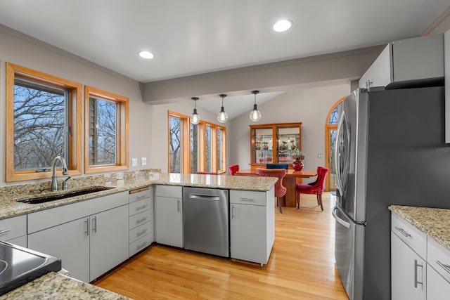 8440 Delaney Ct, Inver Grove Heights, MN 55076 - kitchen featuring a sink, stainless steel appliances, light wood-type flooring, pendant lighting, and recessed lighting